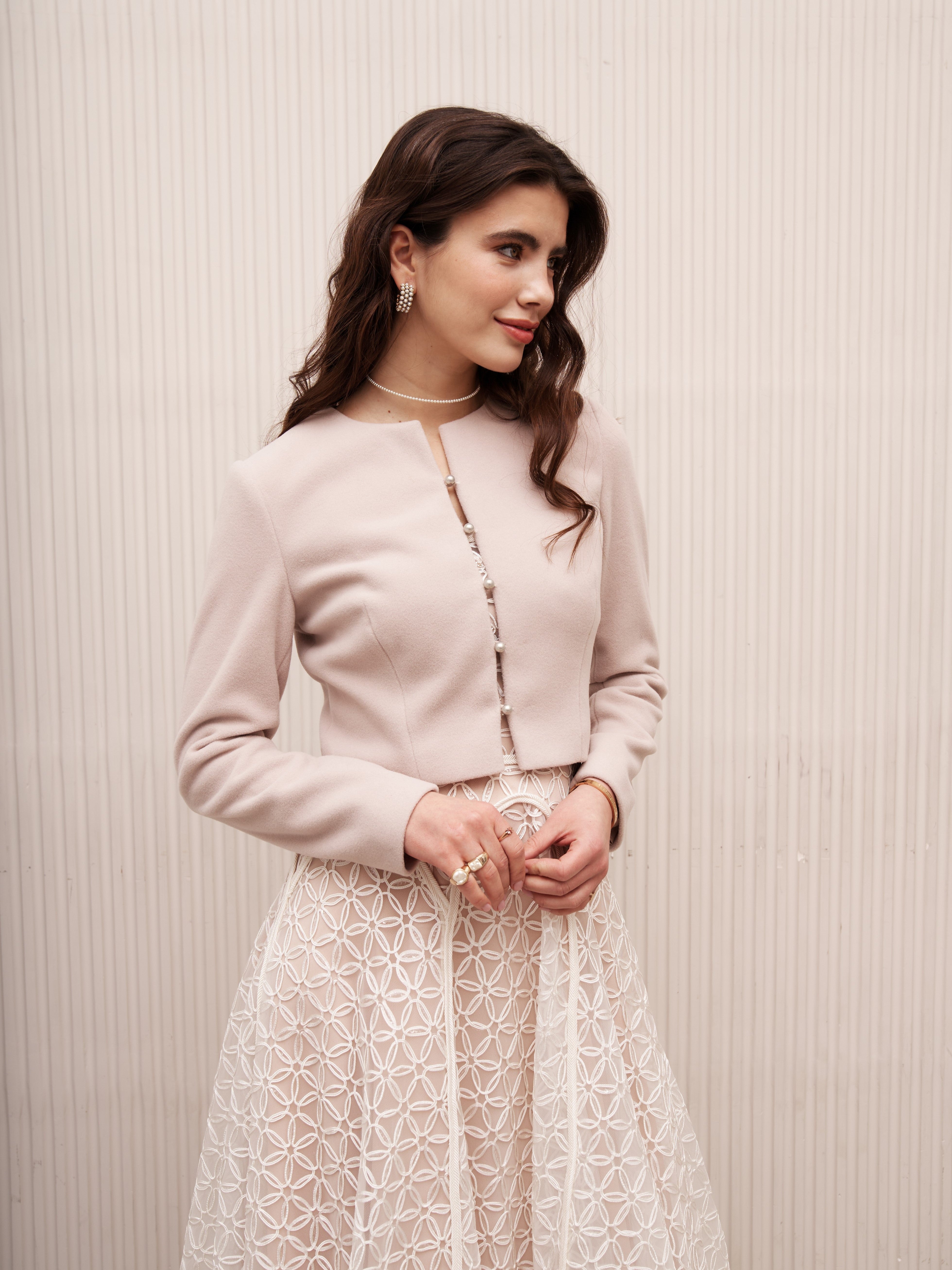 Blush bridal jacket with pearl buttons