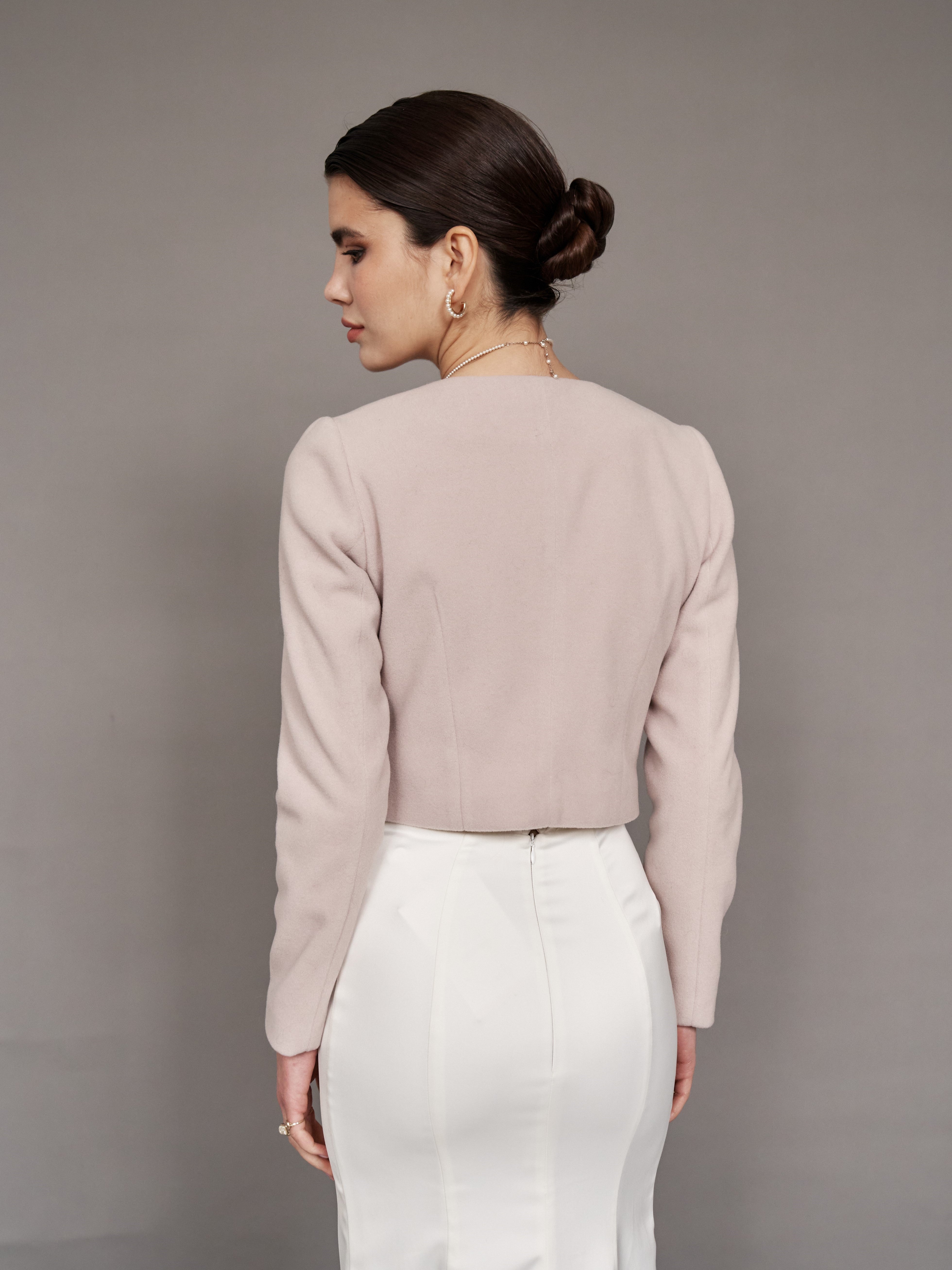 Blush bridal jacket with pearl buttons