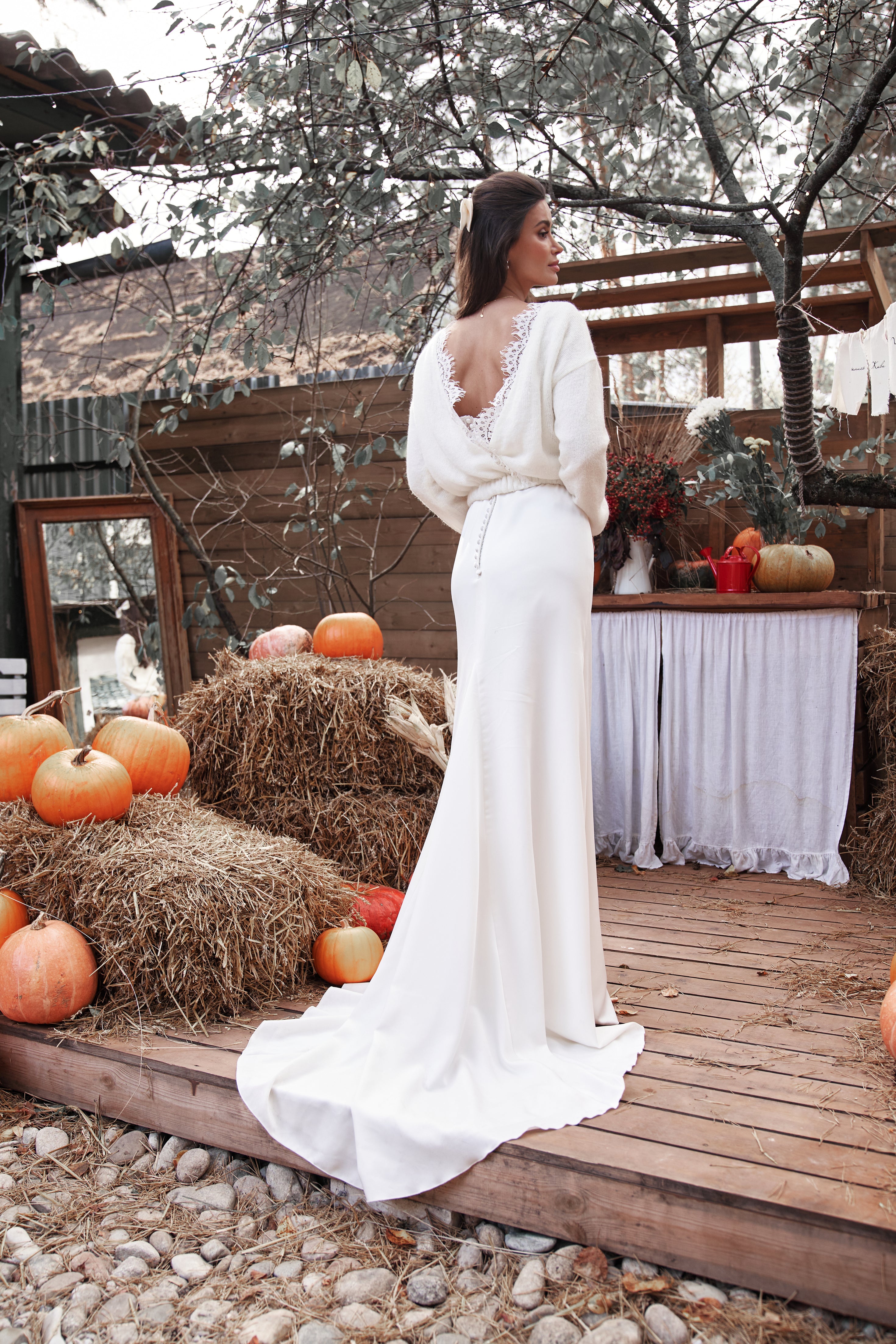 Wedding knitted sweater with deep V-cut and lace decoration.