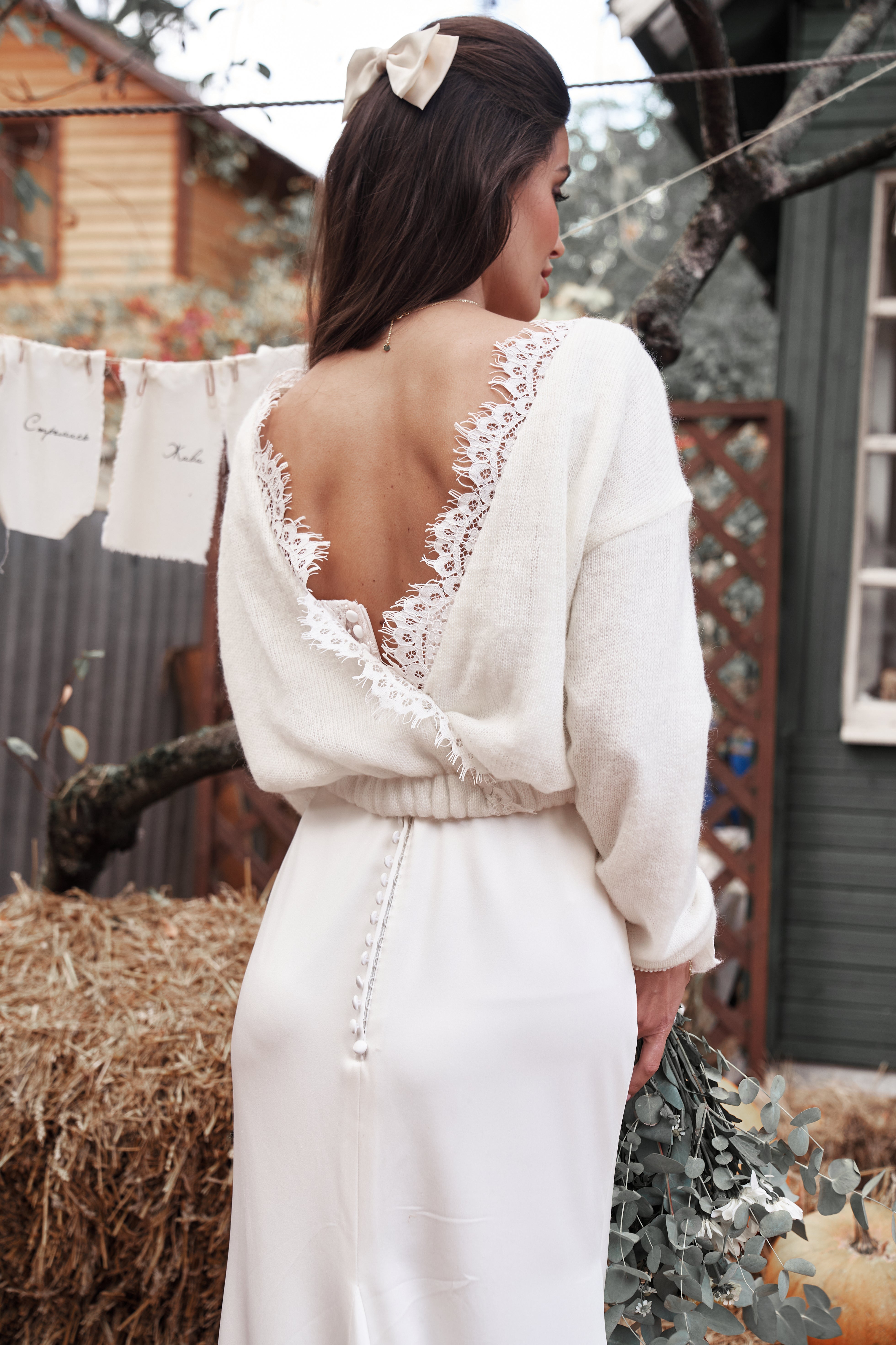 Wedding knitted sweater with deep V-cut and lace decoration.