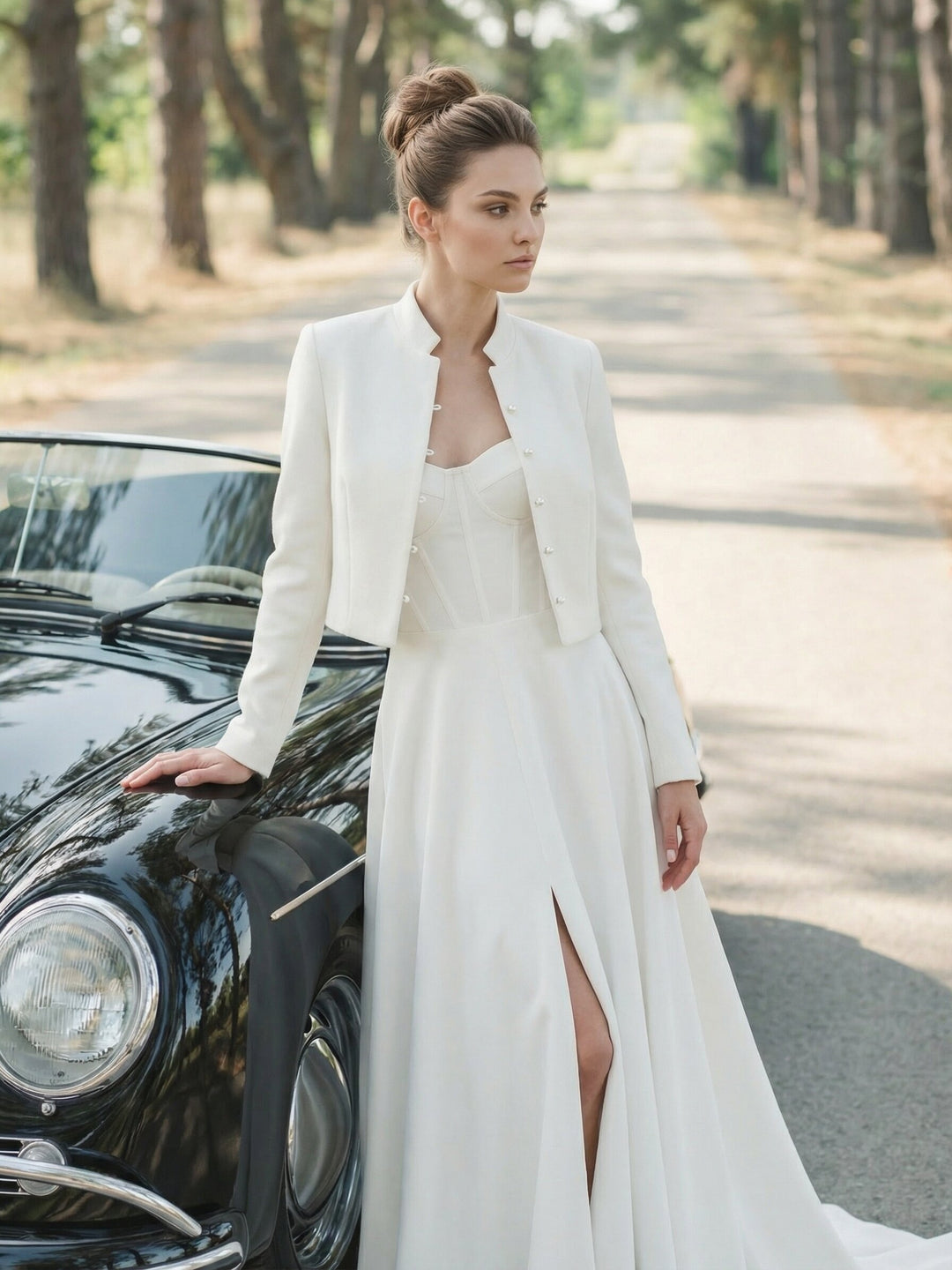 Bride wearing a cropped wool and cashmere jacket with a long white bridal skirt