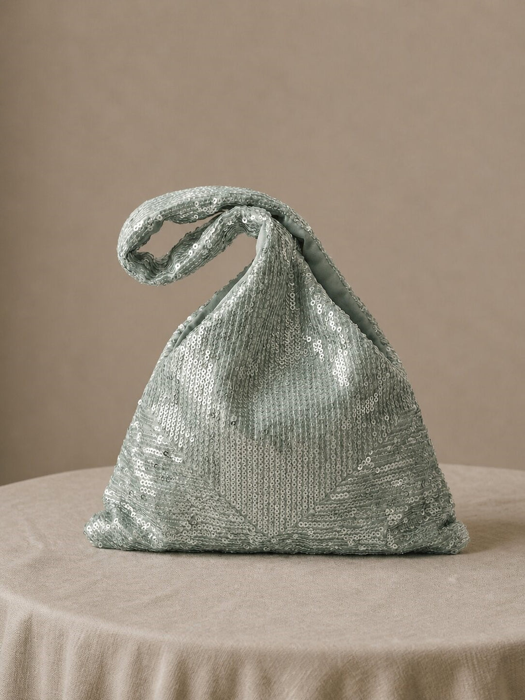 Mint green sequin Japanese Knot Purse shown on a neutral background