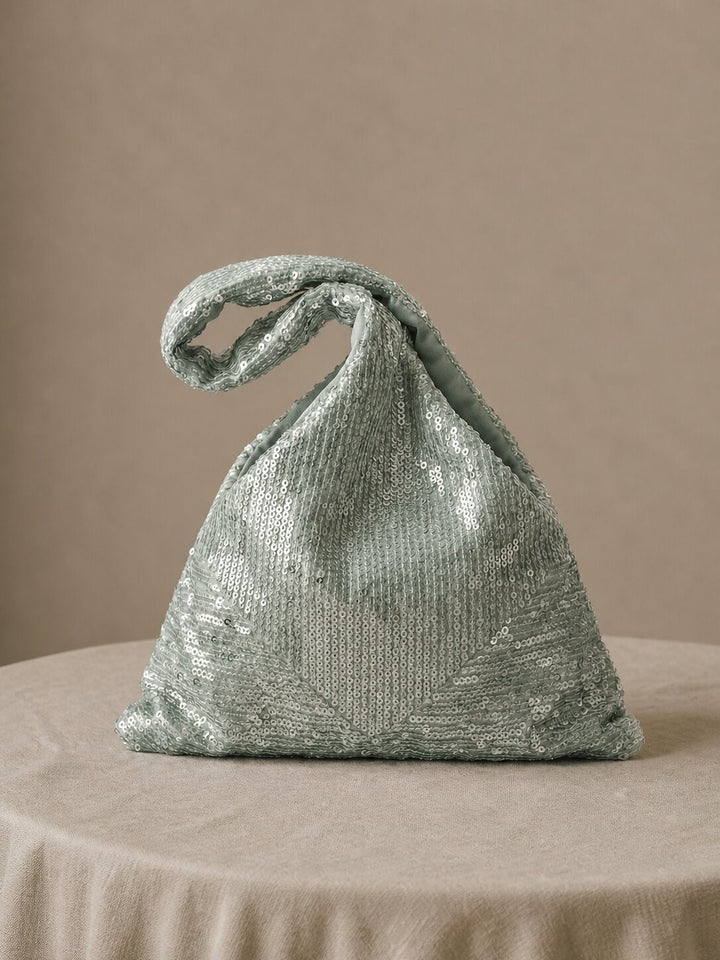 Mint green sequin Japanese Knot Purse shown on a neutral background