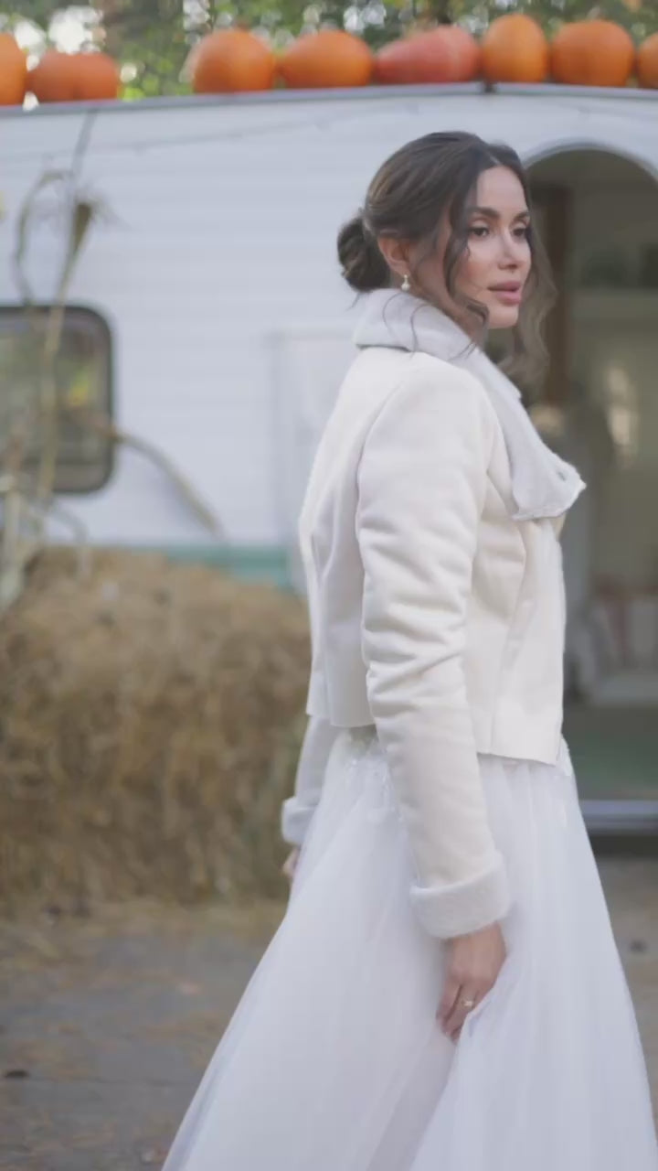 Sheepskin coat for a bride in ivory pearl color.