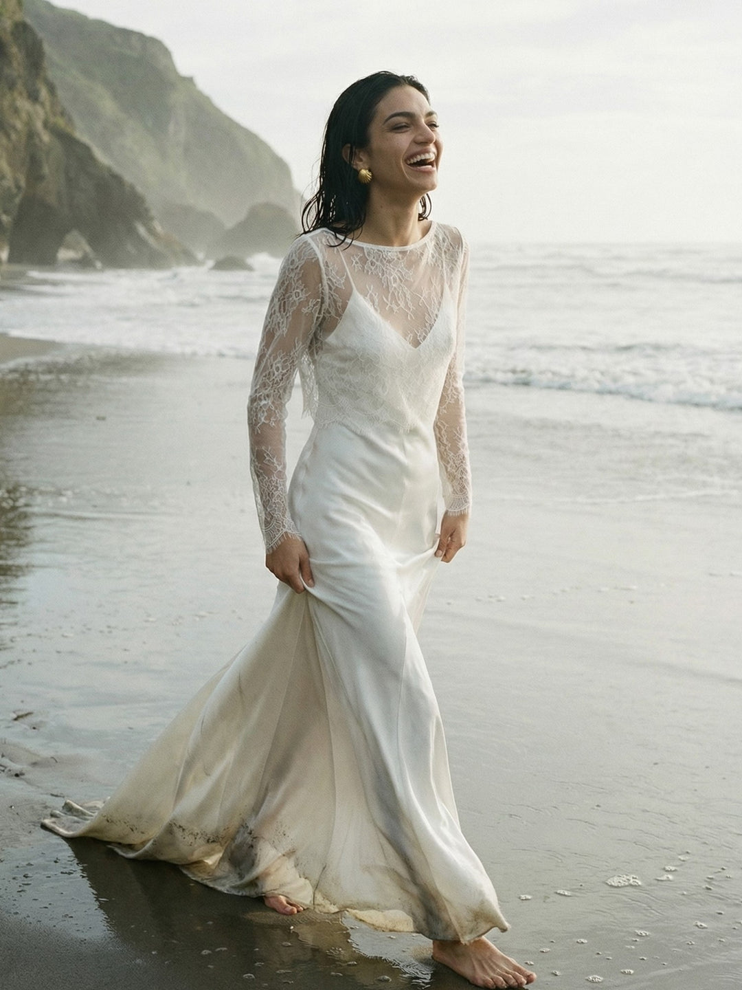 Side view of a bride wearing a sheer lace layer over a white wedding gown