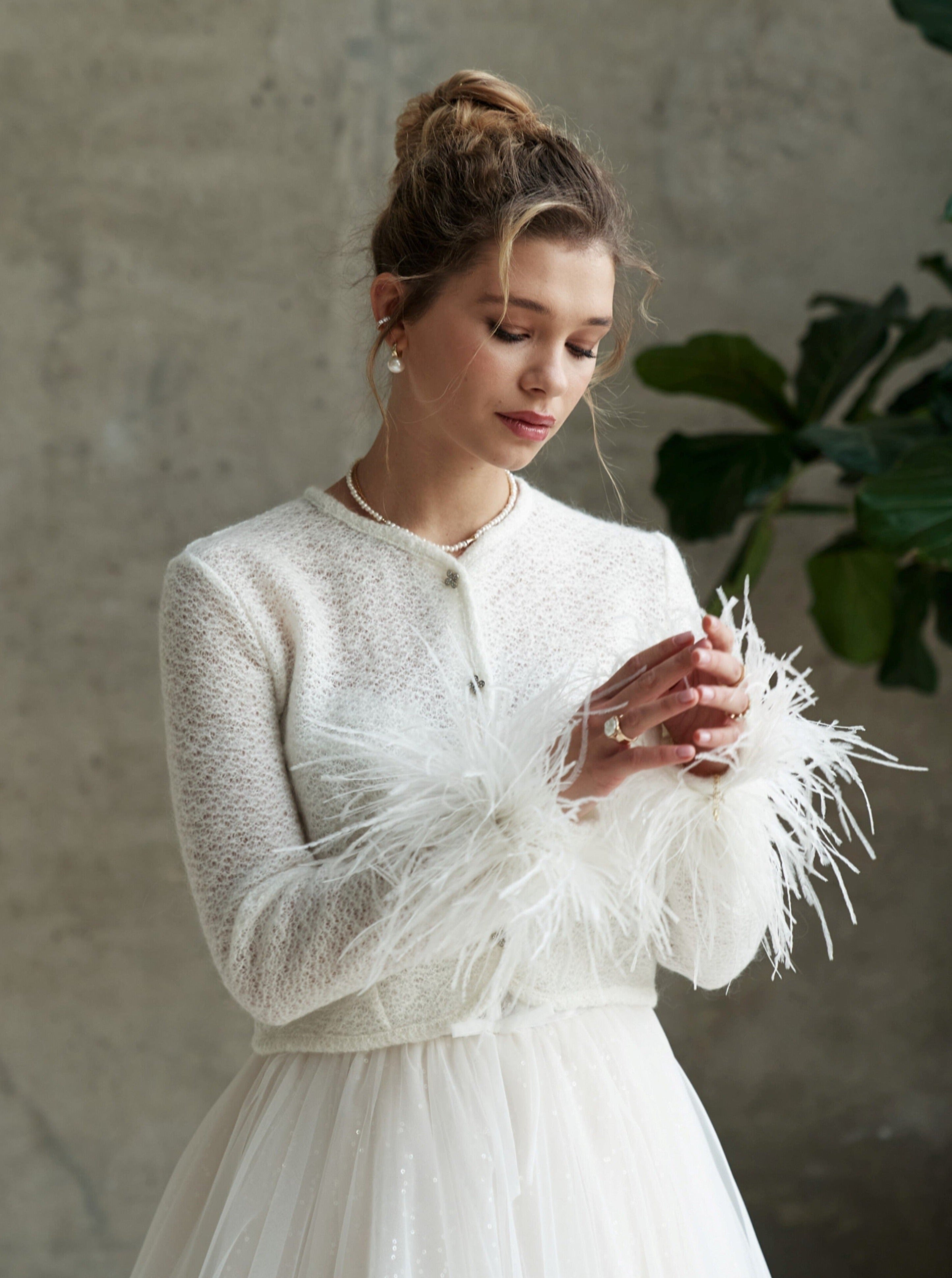 Bridal wedding jacket with feather cuffs. Wedding cardigan with feather decorated sleeves.