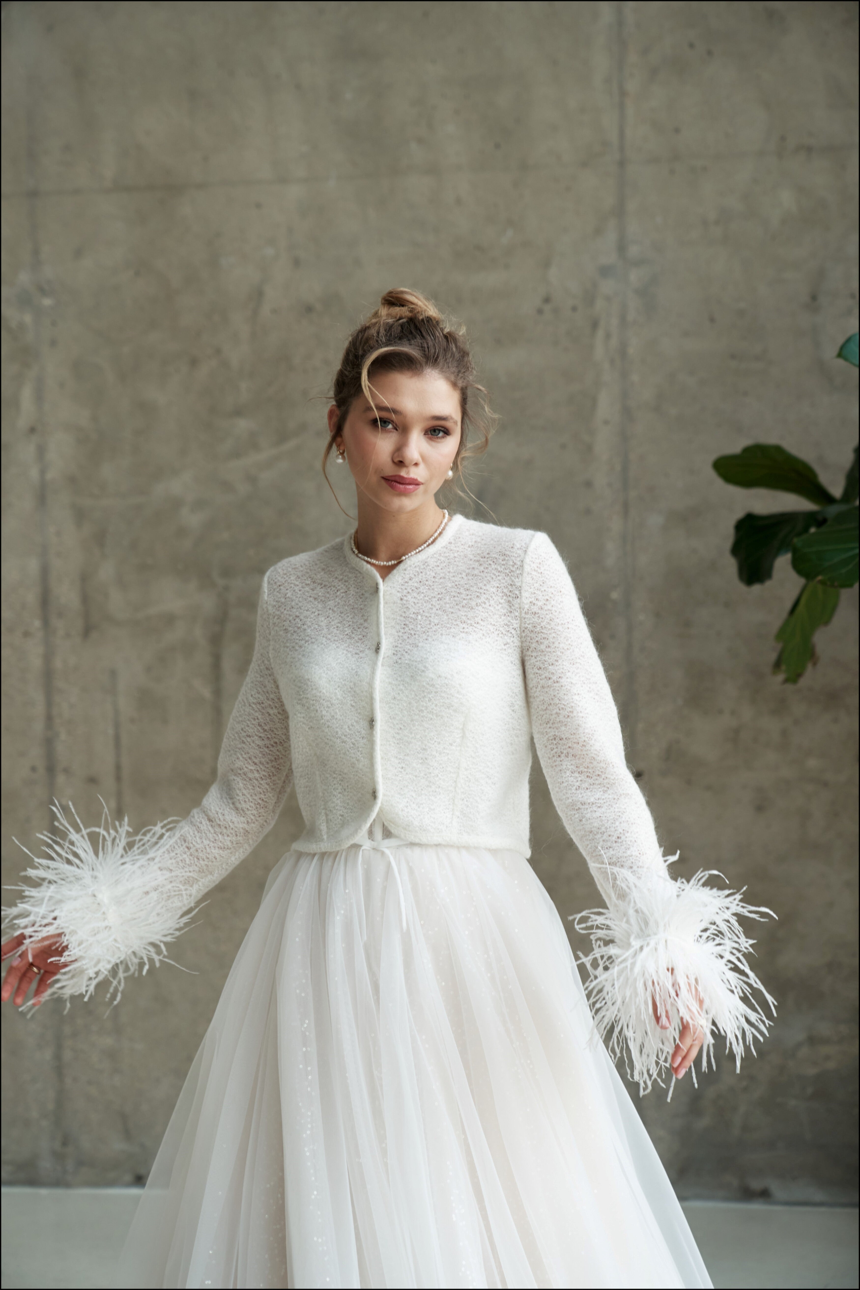 Bridal wedding jacket with feather cuffs. Wedding cardigan with feather decorated sleeves.