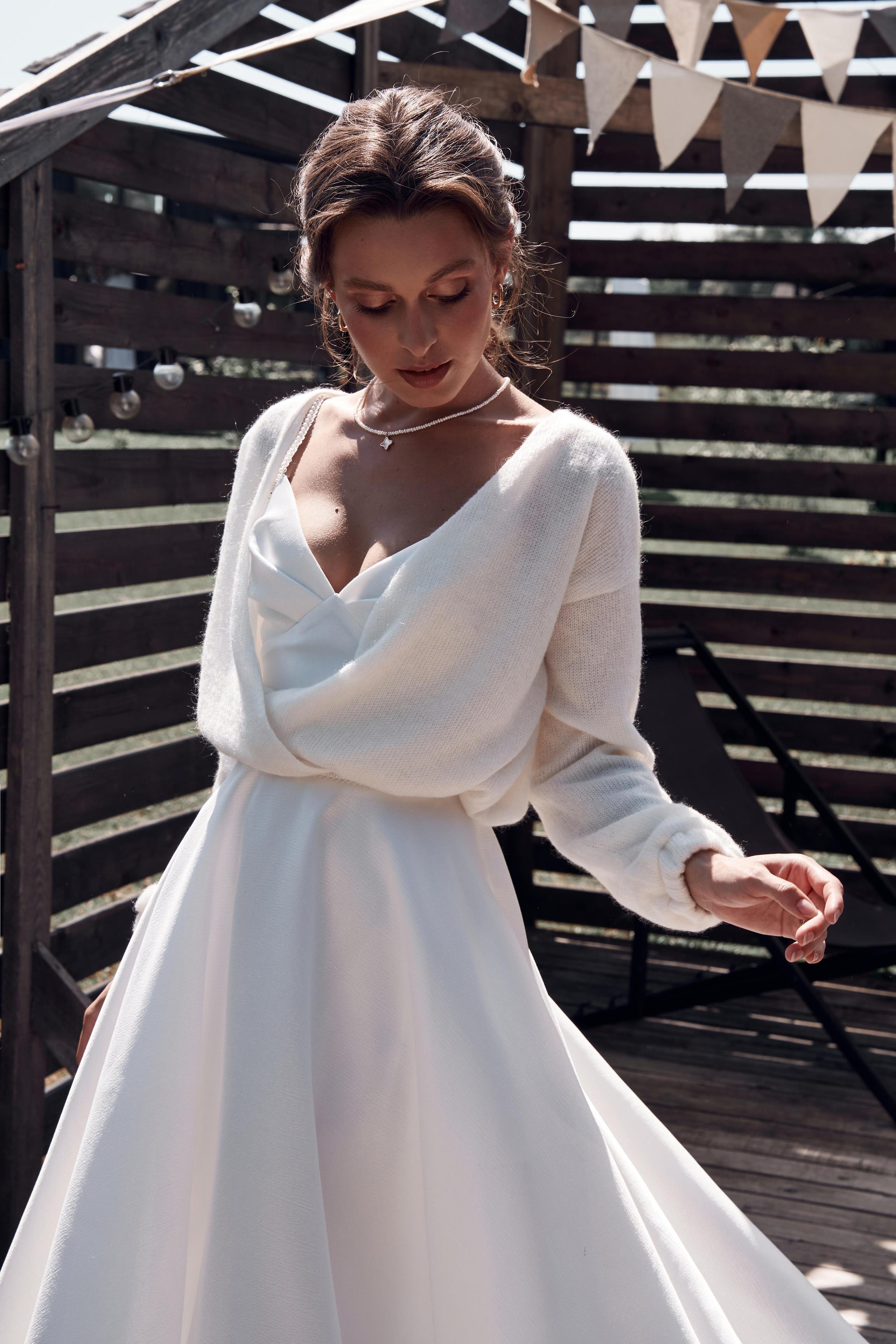 Jersey de novia de punto en color marfil con lazo
