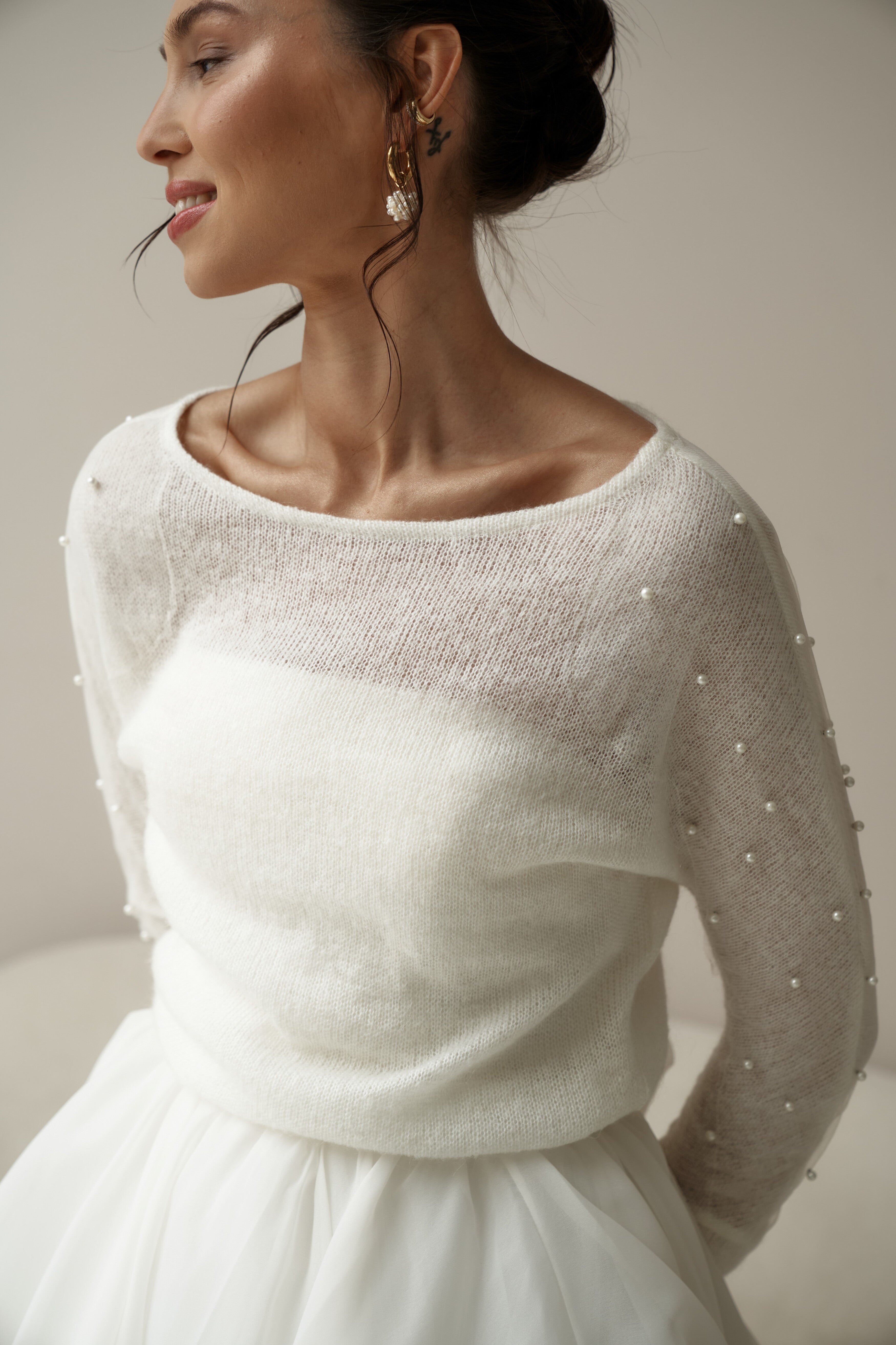 Bridal knitted sweater with pearls. Bridal pullover with decorated sleeves.